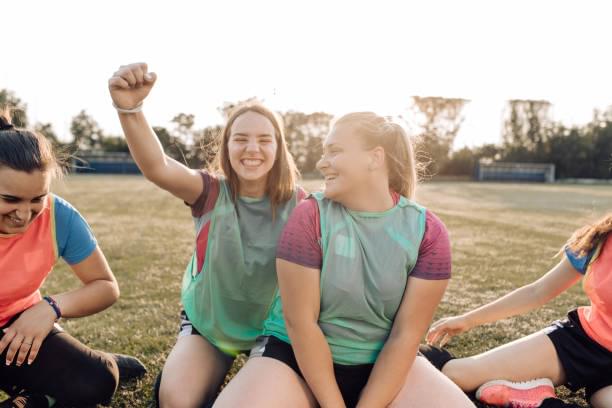Teenage athletes celebrating together